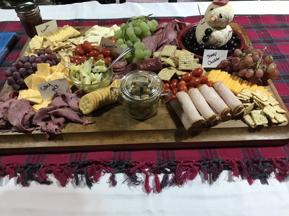 Cheeseboard with snowman cheeseball Christmas Eve Traditions