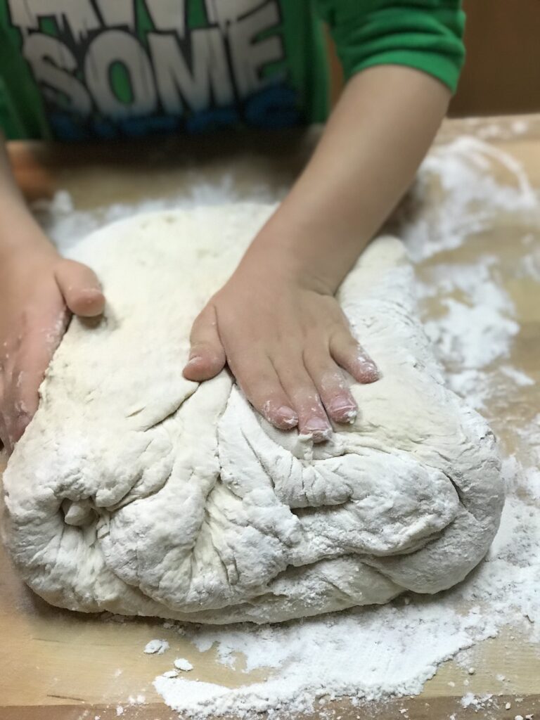 kid kneading dough